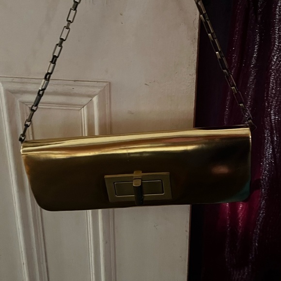 NWT - Olga berg gold clutch bag. NWT. Comes with chain strap. Rectangular clasp. - Picture 9 of 15
